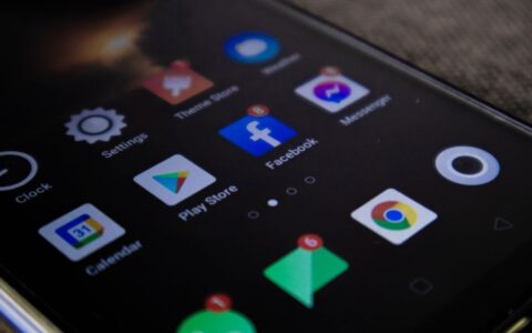 Detailed view of a smartphone screen with popular app icons including Facebook and Messenger.